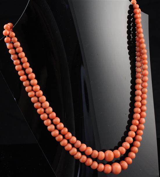 A double strand graduated coral bead necklace, 21in.